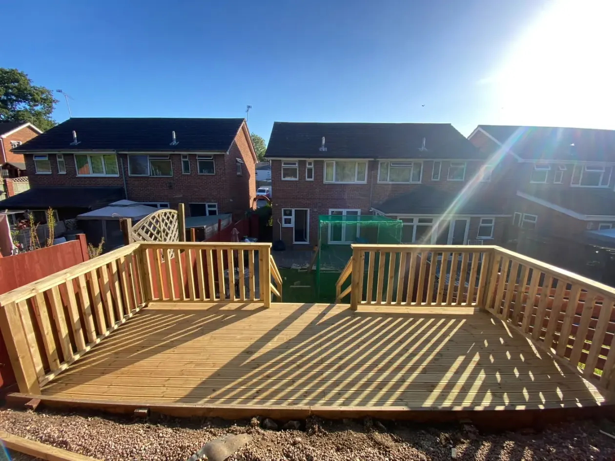 Raised timber deck with spindle balustrade and steps